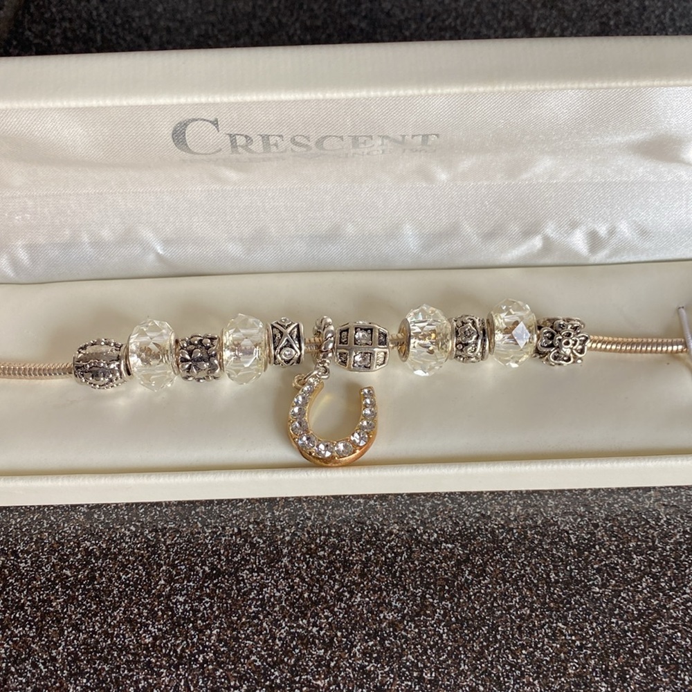 Crescent Jewelers Horseshoe Bracelet with Swarovski Crystals and Charms.